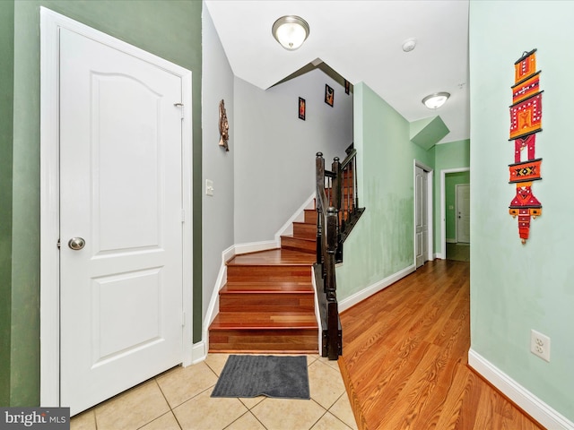 12404 Carriage Park Pl, Clarksburg, MD 20871 - entrance foyer with stairs and light tile patterned floors
