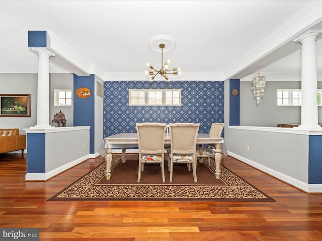 12404 Carriage Park Pl, Clarksburg, MD 20871 - dining room with wallpapered walls, decorative columns, a chandelier, an accent wall, and wood finished floors