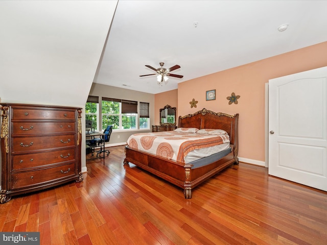 12404 Carriage Park Pl, Clarksburg, MD 20871 - bedroom with wood finished floors, an office area, and a ceiling fan