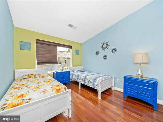 12404 Carriage Park Pl, Clarksburg, MD 20871 - bedroom featuring wood finished floors and vaulted ceiling
