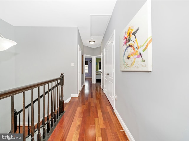 12404 Carriage Park Pl, Clarksburg, MD 20871 - corridor with wood finished floors and an upstairs landing