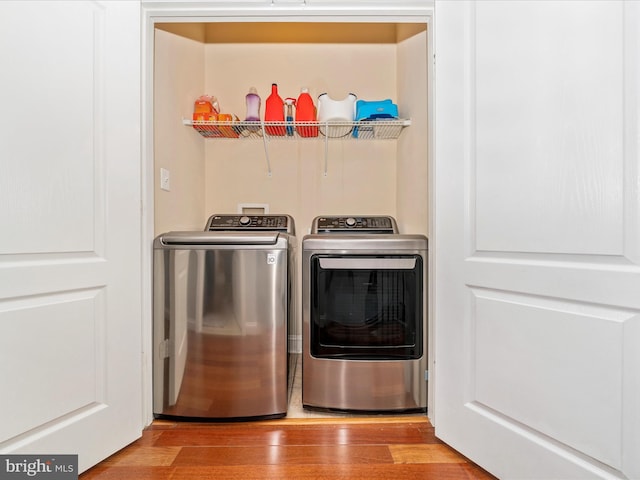 12404 Carriage Park Pl, Clarksburg, MD 20871 - laundry area with independent washer and dryer and wood finished floors