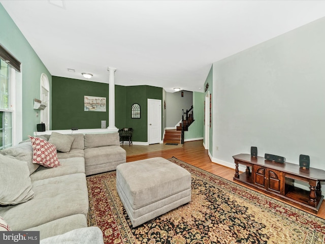 12404 Carriage Park Pl, Clarksburg, MD 20871 - living room featuring ornate columns, wood finished floors, and stairway