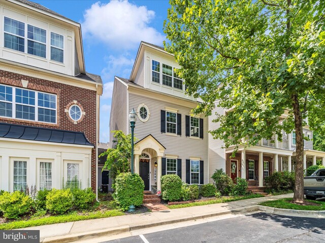 12404 Carriage Park Pl, Clarksburg, MD 20871 - view of front of house with uncovered parking and a standing seam roof