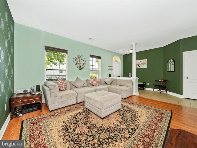 12404 Carriage Park Pl, Clarksburg, MD 20871 - living area featuring decorative columns and wood finished floors