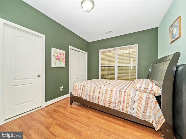 12404 Carriage Park Pl, Clarksburg, MD 20871 - bedroom with wood finished floors and a closet
