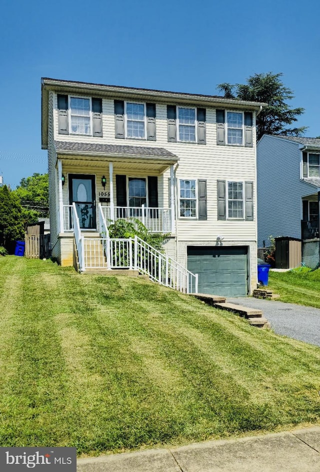 1055 View St, Hagerstown, MD 21742 - view of front of home with driveway, a garage, a front yard, a porch, and stairs