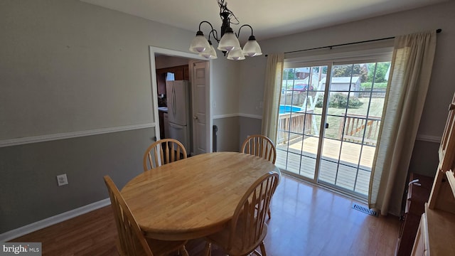 1055 View St, Hagerstown, MD 21742 - dining area with a chandelier and dark wood-type flooring