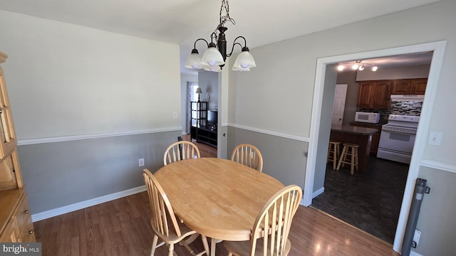 1055 View St, Hagerstown, MD 21742 - dining area with dark wood-style flooring and a chandelier