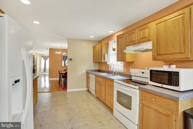 311 Woodside, West Lawn, PA 19609 - kitchen featuring white appliances, under cabinet range hood, light flooring, a chandelier, and recessed lighting