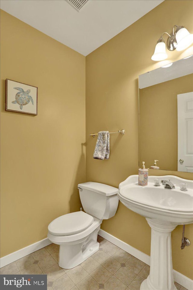 311 Woodside, West Lawn, PA 19609 - half bathroom with toilet and tile patterned flooring