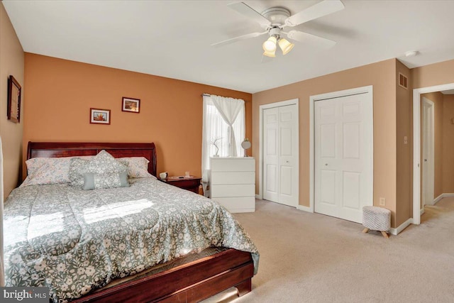 311 Woodside, West Lawn, PA 19609 - bedroom featuring multiple closets, carpet floors, and a ceiling fan