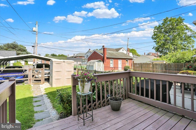 311 Woodside, West Lawn, PA 19609 - wooden terrace featuring a storage unit and a residential view