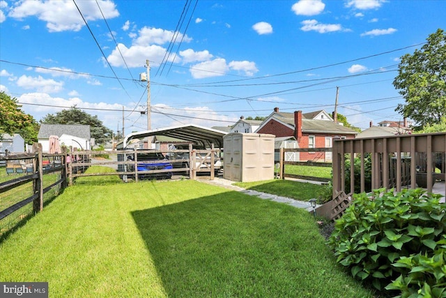 311 Woodside, West Lawn, PA 19609 - fenced yard featuring a carport and a storage unit