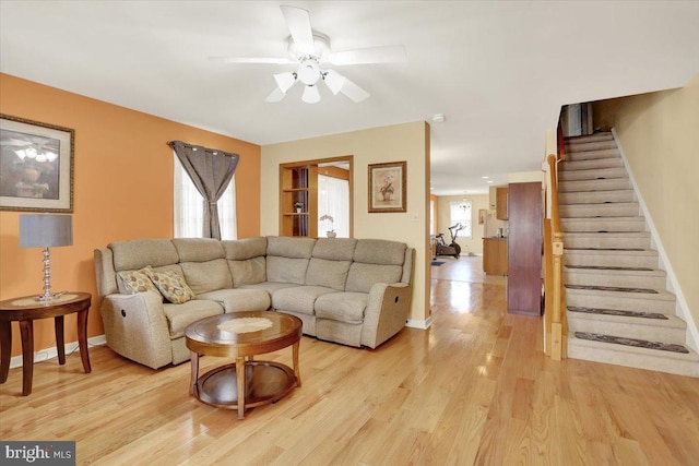 311 Woodside, West Lawn, PA 19609 - living room with stairs, a ceiling fan, and light wood-type flooring