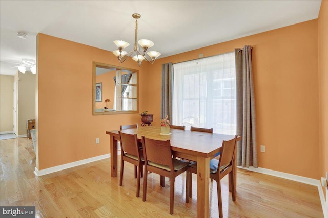 311 Woodside, West Lawn, PA 19609 - dining space with a chandelier, light wood-style flooring, and a ceiling fan
