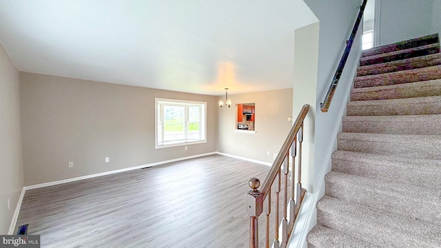 1000 Old Forge Rd, New Castle, DE 19720 - staircase with wood finished floors and a chandelier