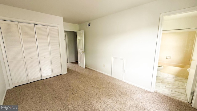 1000 Old Forge Rd, New Castle, DE 19720 - unfurnished bedroom featuring carpet flooring, a closet, and ensuite bath
