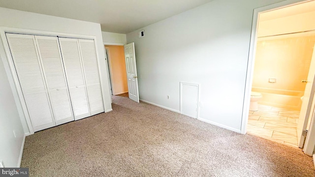 1000 Old Forge Rd, New Castle, DE 19720 - unfurnished bedroom with carpet floors, a closet, and ensuite bath