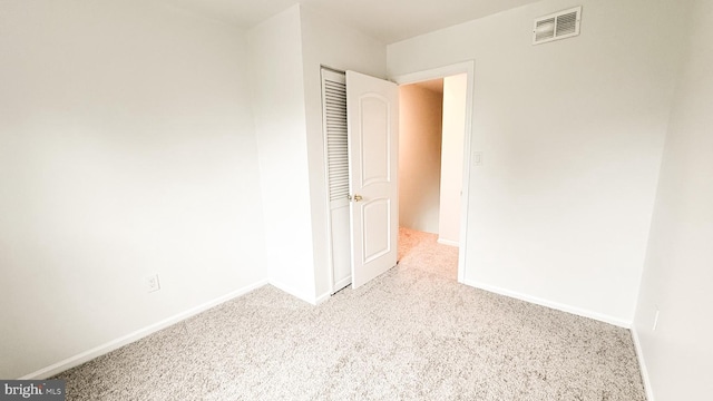 1000 Old Forge Rd, New Castle, DE 19720 - unfurnished bedroom with carpet floors and a closet