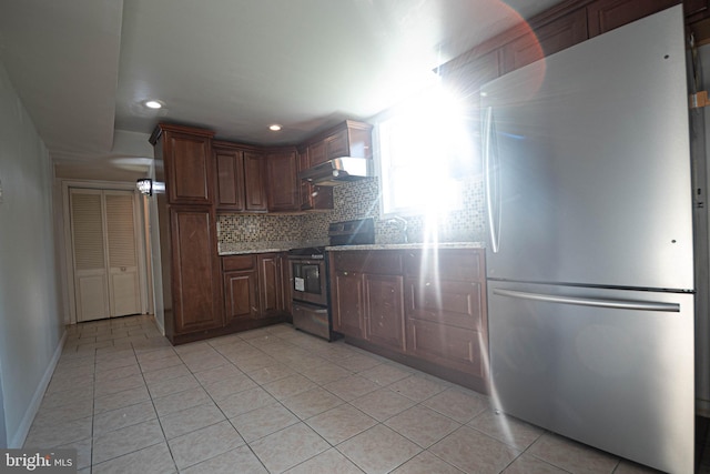 1262 Everett Ave, Woodbridge, VA 22191 - kitchen with appliances with stainless steel finishes, under cabinet range hood, light tile patterned floors, and recessed lighting