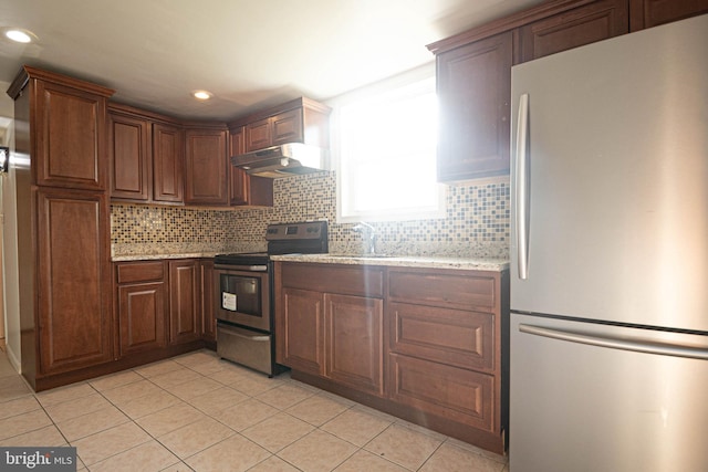 1262 Everett Ave, Woodbridge, VA 22191 - kitchen featuring freestanding refrigerator, electric range, under cabinet range hood, light tile patterned floors, and recessed lighting