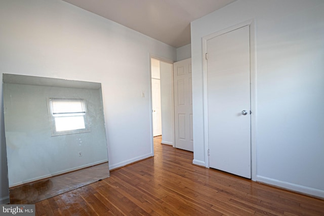 1262 Everett Ave, Woodbridge, VA 22191 - unfurnished bedroom with wood finished floors and baseboards