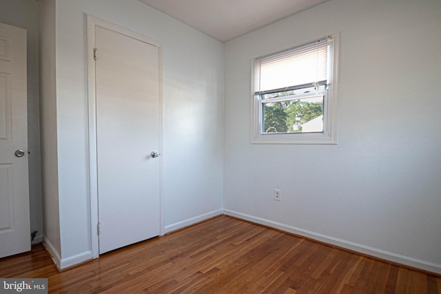 1262 Everett Ave, Woodbridge, VA 22191 - unfurnished bedroom featuring wood finished floors and baseboards