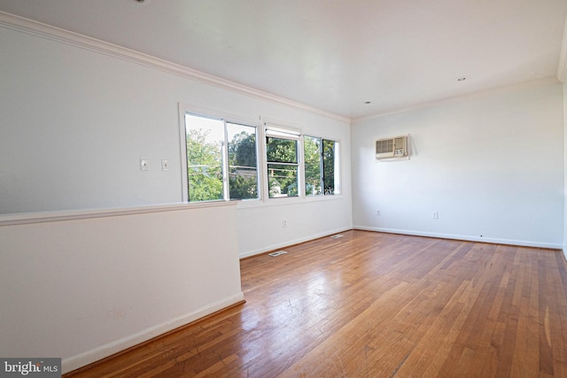 1262 Everett Ave, Woodbridge, VA 22191 - empty room with a wall mounted AC, hardwood / wood-style floors, and ornamental molding