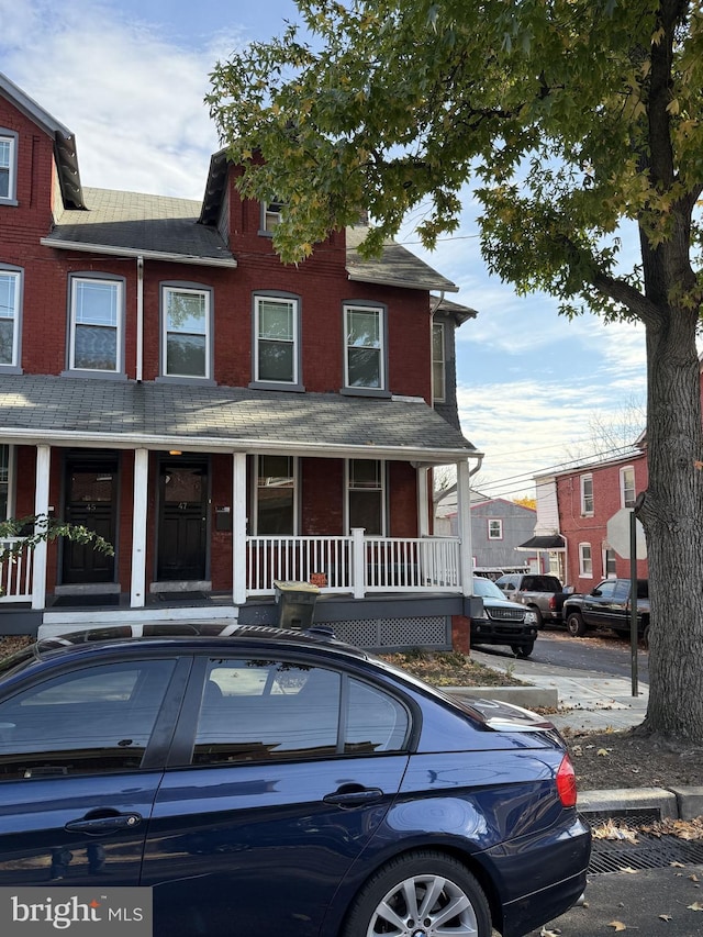 47 S Marshall St, Lancaster, PA 17602 - multi unit property with covered porch, brick siding, and roof with shingles