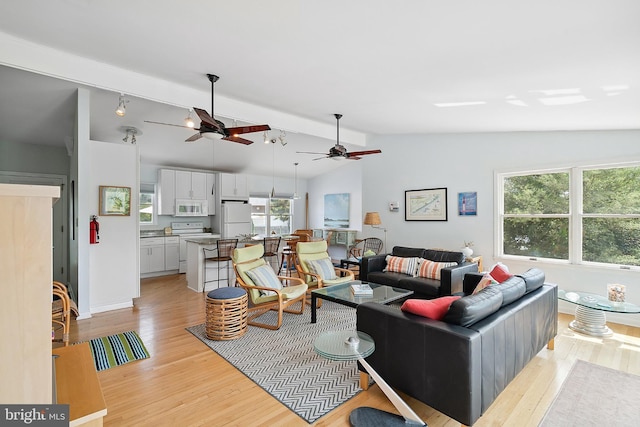 365 Dusty Miller Dr, Long Beach, NJ 08008 - living area featuring light wood finished floors, plenty of natural light, and a ceiling fan