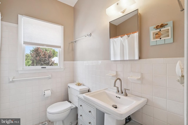 365 Dusty Miller Dr, Long Beach, NJ 08008 - bathroom featuring tile walls, wainscoting, and a shower with curtain