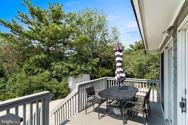365 Dusty Miller Dr, Long Beach, NJ 08008 - wooden terrace featuring outdoor dining area and view of scattered trees