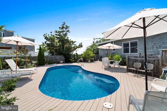 365 Dusty Miller Dr, Long Beach, NJ 08008 - view of swimming pool with a wooden deck and a fenced backyard