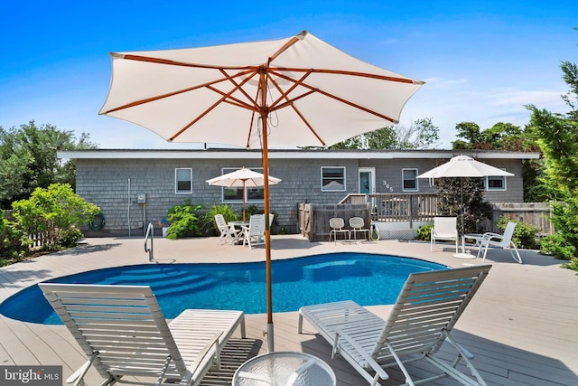 365 Dusty Miller Dr, Long Beach, NJ 08008 - swimming pool with a wooden deck and outdoor dining space
