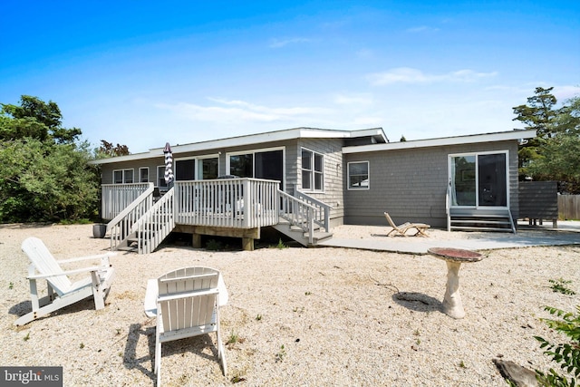 365 Dusty Miller Dr, Long Beach, NJ 08008 - back of property featuring a wooden deck, a patio, and stairs