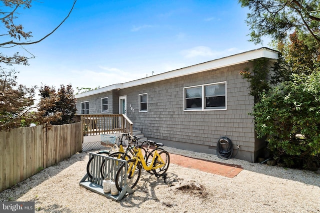 365 Dusty Miller Dr, Long Beach, NJ 08008 - rear view of house with a wooden deck