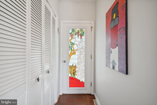 365 Dusty Miller Dr, Long Beach, NJ 08008 - doorway to outside featuring dark tile patterned flooring and baseboards