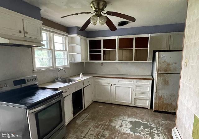 3001 Church Rd, Cherry Hill, NJ 08002 - kitchen featuring stainless steel electric stove, freestanding refrigerator, under cabinet range hood, open shelves, and a ceiling fan