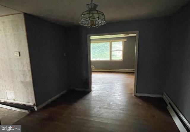 3001 Church Rd, Cherry Hill, NJ 08002 - unfurnished room featuring a baseboard radiator and wood finished floors