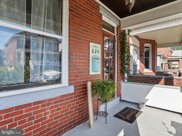 624 Shriver Ave, Cumberland, MD 21502 - property entrance with a porch and brick siding