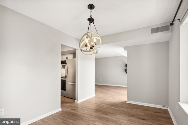 9733 Kings Crown Ct Unit 202, Fairfax, VA 22031 - empty room with wood finished floors and a chandelier