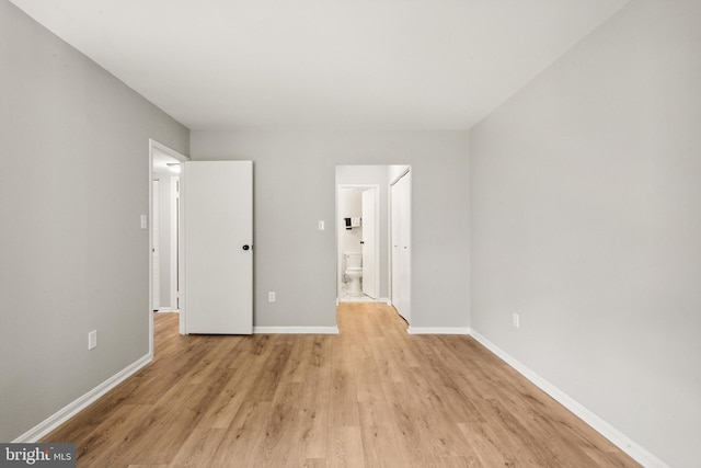 9733 Kings Crown Ct Unit 202, Fairfax, VA 22031 - unfurnished bedroom with light wood finished floors and ensuite bathroom