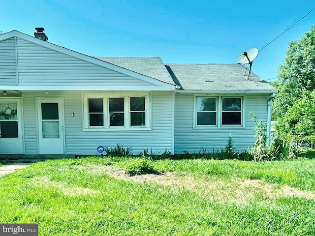 112 Kinsley, Pemberton, NJ 08068 - view of front of property with a front lawn, a shingled roof, and a chimney