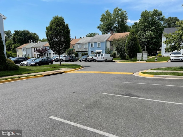 1020 Queens Ct, Herndon, VA 20170 - view of asphalt street with a residential view, curbs, and sidewalks