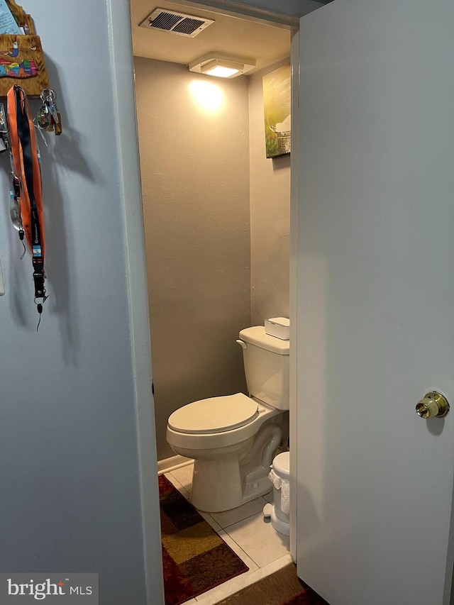 1020 Queens Ct, Herndon, VA 20170 - bathroom featuring toilet and tile patterned floors