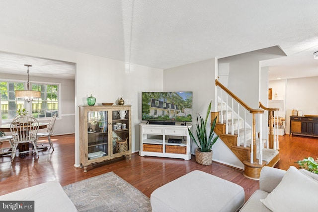 530 Bay Green Dr, Arnold, MD 21012 - living room featuring a chandelier, stairway, and wood finished floors