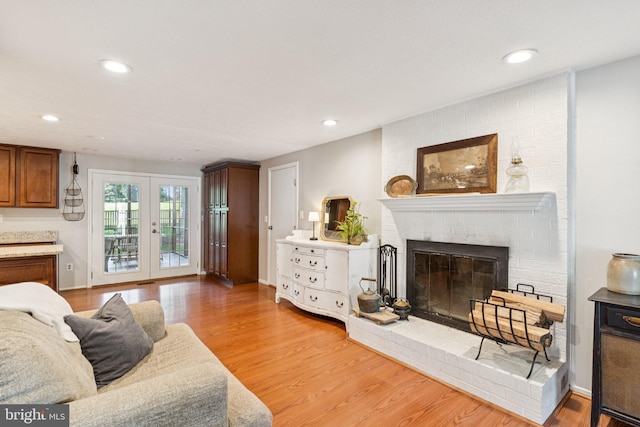 530 Bay Green Dr, Arnold, MD 21012 - living area featuring a brick fireplace, light wood finished floors, recessed lighting, and french doors
