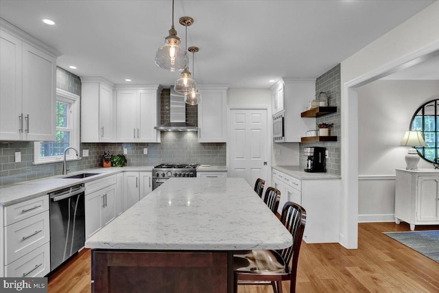 1420 Valley Rd, Lancaster, PA 17603 - kitchen with appliances with stainless steel finishes, wall chimney exhaust hood, open shelves, light wood finished floors, and white cabinetry
