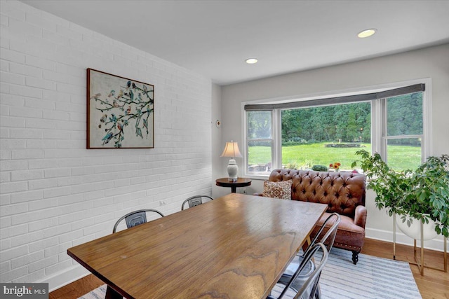 1420 Valley Rd, Lancaster, PA 17603 - dining room with wood finished floors, brick wall, and recessed lighting